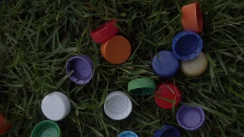 A lot of plastic covers are lying on the lawn Stock Footage 120090011