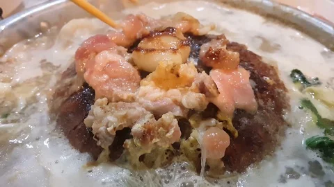 A lot of pork is being grilled on the pan, Pork pan It's traditional Thai style. Stock Footage 121069482