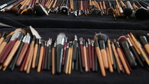 A lot of professional make-up brushes on a table.  Stock Footage 74615081