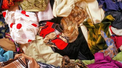 A lot of randomly lying generic clothes top view Foto stock