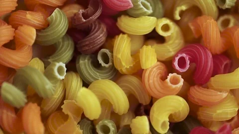 A lot of raw multicolored pasta Stock Footage 83759543