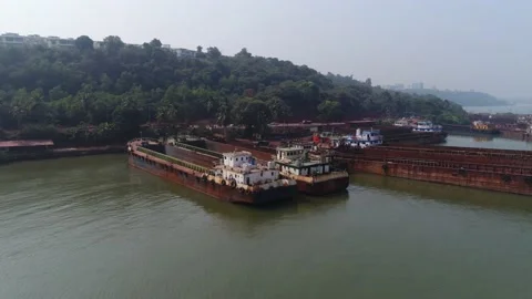 A lot of rusty barges moored off the coast. Drone shot. Stock Footage 85666580
