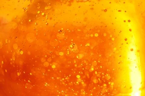 Lot of small bubbles on an orange background, macro shot of liquid soap, macr Stockfoto's