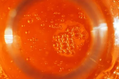 Lot of small bubbles on an orange background, macro shot of liquid soap, macr Stock Photos
