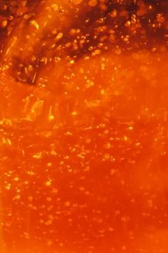 Lot of small bubbles on an orange background, macro shot of liquid soap, macr Stock Photos