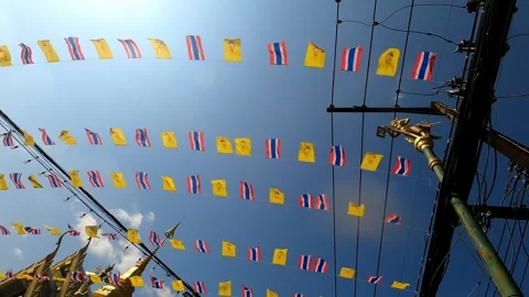 Lot of small flags stretched over the roadway. Stock Footage 243279991