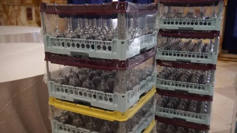 A lot of stacked boxes full of wine glasses and flutes at the wedding .. Stock Footage 72330017