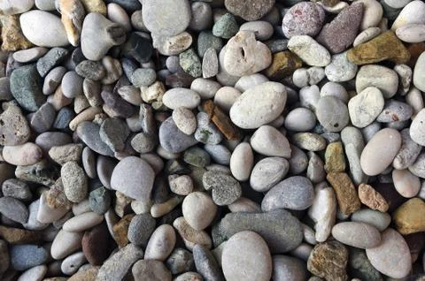 Lot of tiny pebble rocks - great for a cool background or wallpaper Foto stock