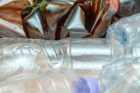 Lot of used plastic, crumpled empty bottles, packets, pollution recycle eco c Stock Photos