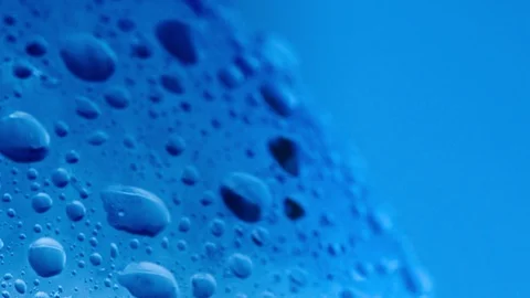 A lot of water drops on bottle surface, macro shot. Dolly shot of bottle covered Stock Footage 127608625