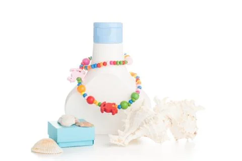 Lotion bottle with seashells Stock Photos