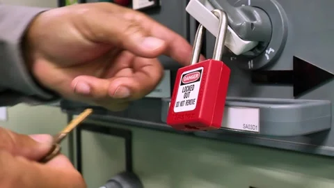 LOTO Procedure Removing Lock After Electrical Isolation Work Stock Footage 336566046