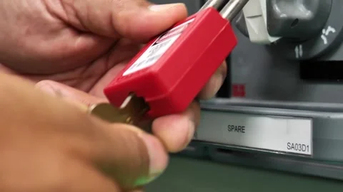 LOTO Procedure Removing Lock After Electrical Isolation Work Stock Footage 336566070