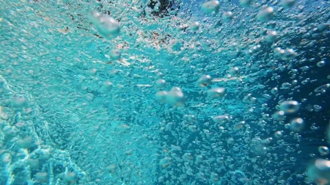 Lots of air bubbles float in the blue water of the pool. Stock Footage 168348199