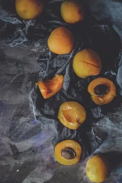 Lots of apricots on a black background Stock Photos