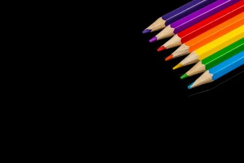 Lots of assorted colors pencils with copyspace on black background Stock Photos