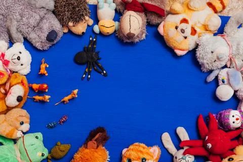 Lots of baby soft animal toys for blue background games Stock Photos
