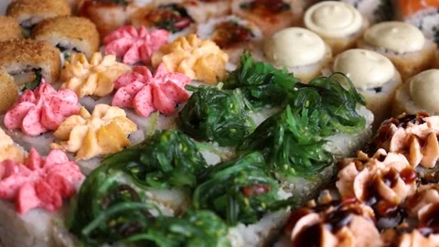 Lots of beautiful rolls slow motion soy rice sushi Stock Footage 168341917