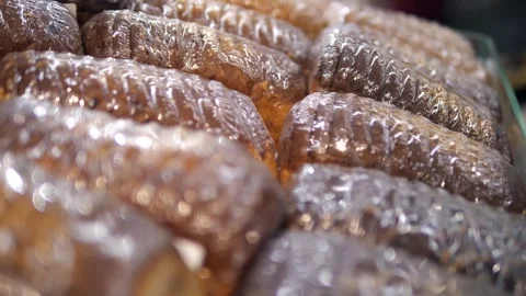 Lots of bread or loaf lying in a row. Stock Footage 312869659