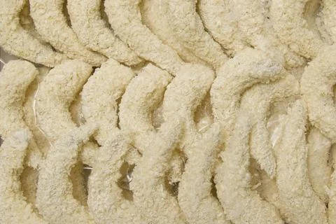 Lots of breaded shrimp ready to cook. A semi-finished dish. Shrimp background Stock Photos