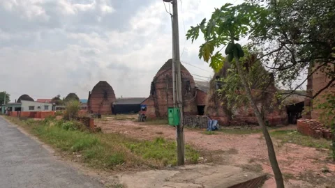 Lots of brick kilns baking bricks in Mang Thit pottery village Vinh Long Vietnam Stock-Footage 244198480