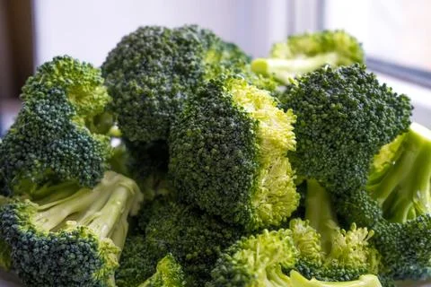 Lots of broken broccoli. Cooking broccoli. Stock Photos