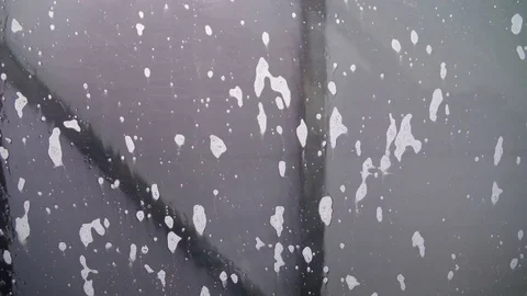Lots of bubbles on the windshield of the car Stock Footage 72104994