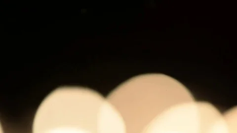 Lots of candles burning in the dark. Defocusing, White light, bokeh Stock Footage 70497348