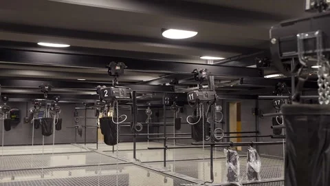 Lots of Ceiling Mounted Electric Chain Hoists above Tension Wire Grid Floor Stock Footage 262111907