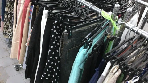 Lots of clothes at a second hand shop 스톡 동영상 116107381