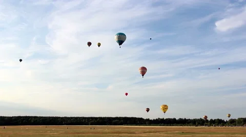 Lots of colored balloons flying in the sky over the forest, fast shooting Stock-Footage 52423965