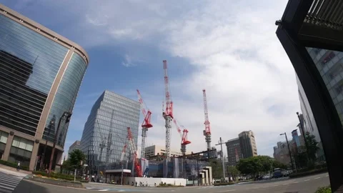 Lots of cranes lifting construction materials in urban area. Construction site o Stock Footage 246476362