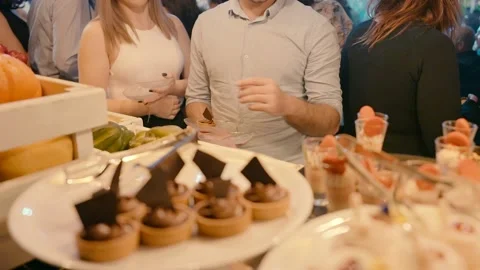 Lots of desserts on the table for wedding guests. Stock Footage 233197476