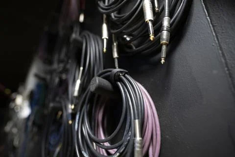 Lots of different audio and internet cables in a dark studio room Stock Photos