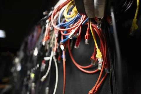 Lots of different audio and internet cables in a dark studio room Stock Photos