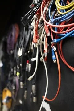 Lots of different audio and internet cables in a dark studio room Stock Photos