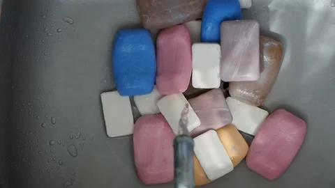 Lots of different bars of soap in the iron sink. Stock Footage 131350391