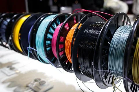 Lots of different coils with Colorful plastic PLA and ABS with filament for Stock Photos