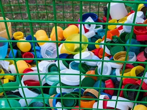Lots of different plastic bottle caps. Garbage sorting Stock Photos