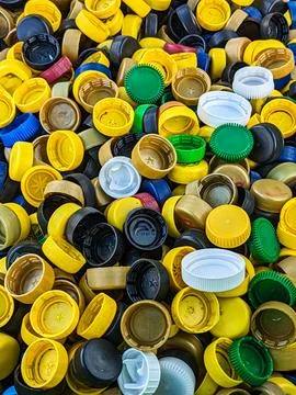 Lots of different plastic bottle caps. Garbage sorting Stock Photos