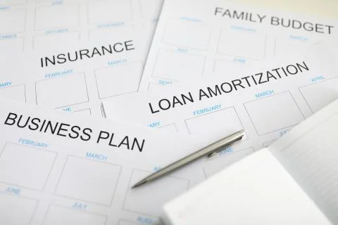 Lots of different schedule lists lying at desk ready to be filled Stock Photos