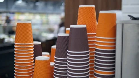 Lots of disposable paper cups for drinks and coffee in different colors. Stock Footage 314361093