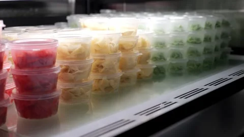 Lots of disposable plastic small containers with ginger and wasabi. Stock Footage 346442738