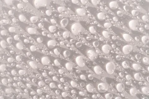Lots of drops on a white background. Stock Photos