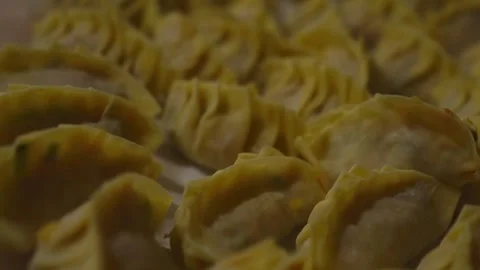 Lots of dumplings arranged on the table Stock Footage 262265243