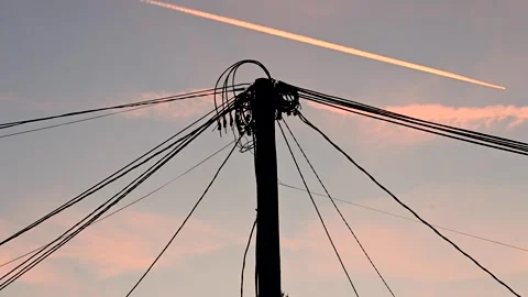 Lots of electrical cables on a pole during sunset. Electricity. Stock Footage 259853065