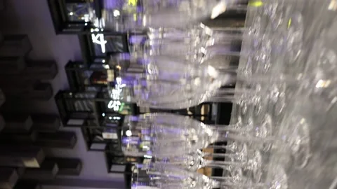 Lots of empty champagne glasses. Vertical video. 4k Stock Footage 230169544