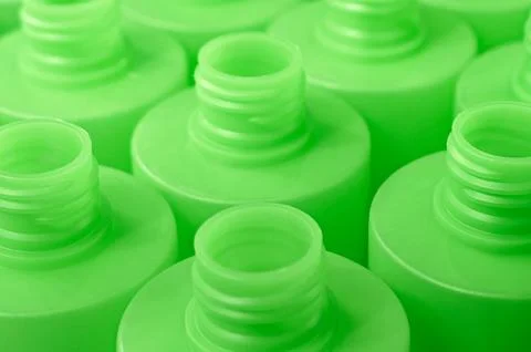 Lots of empty green plastic bottles, production or recycling line Stock Photos