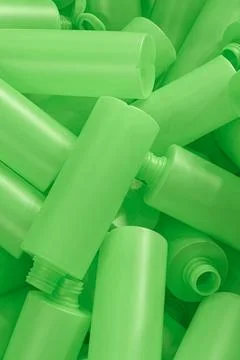 Lots of empty green plastic bottles, production or recycling line Stock Photos