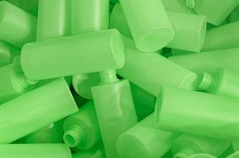 Lots of empty green plastic bottles, production or recycling line Stock Photos